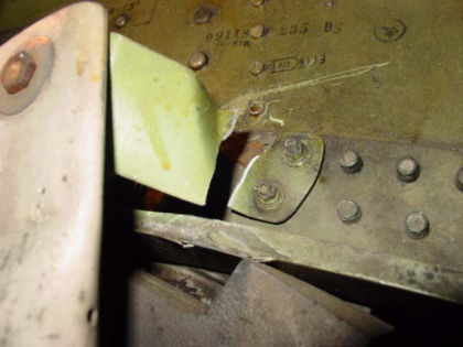 Photo 5. Fractured catwalk railing bracket on N804ME