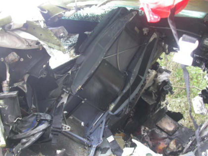 Photo 11. Portion of first officer’s seat still attached to the cockpit floor structure
