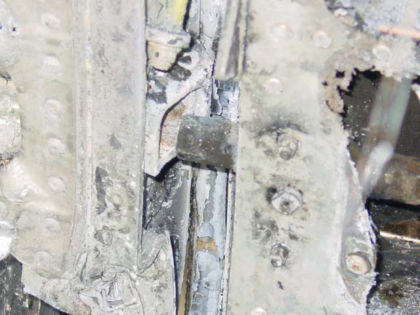 Photo 14. One of the main cabin door’s extended aft lock pins