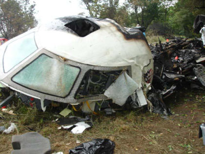 Photo 16. Cockpit damage and left side of the fuselage