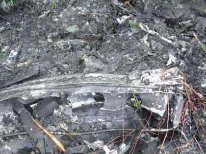 Photo 22. A section of floor track with a fractured aft seat attachment fitting
