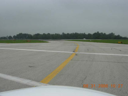 Photo 31. T/W A and T/W A holding position sign for runway 22 as viewed from the