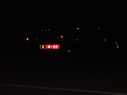 Photo 33. T/W A holding position sign for runway 22 as viewed from a 15-passenger van
