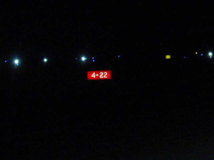 Photo 36. Runway 4/22 intersection sign as viewed from a 15-passenger van on the