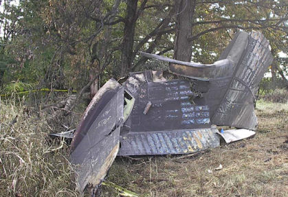 Figure 15 Accident #: DCA06MA064 N431CA Description:. Empennage viewed looking left to right. (left)