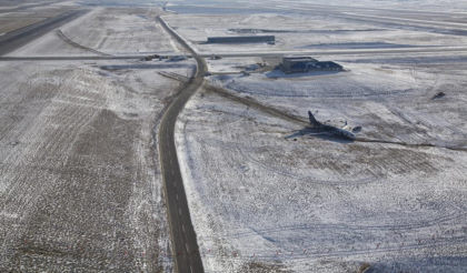 Photograph 1: Ground track of airplane from Runway 34R .