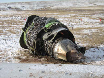 PHOTO 1: NO. 1 ENGINE DETACHED PHOTO 2: FORWARD & LEFT OF LEFT WING (right)