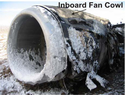 PHOTO 14: UNDERCOWL FIRE DAMAGE (left)