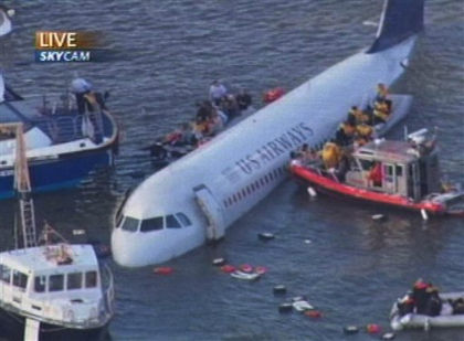Photo 17. Passengers being rescued from the left and right offwing slides