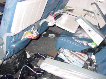 Photo 33. View of row 22 DEF showing floor damage