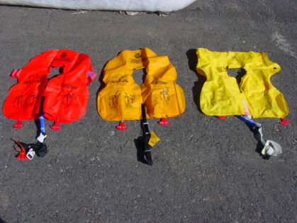 Photo 54. Life vest storage pouches beneath economy class passenger seats (left)
