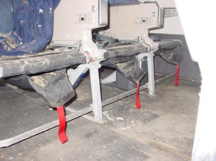 Photo 54. Life vest storage pouches beneath economy class passenger seats (right)