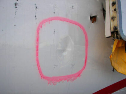Photo 4 — Left hand side forward fuselage soft body impact damage.