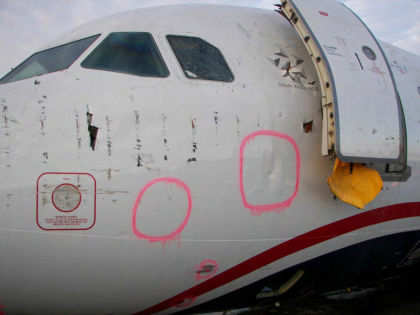 Photo 6 — Left hand side forward fuselage damage FR1 to FR12.