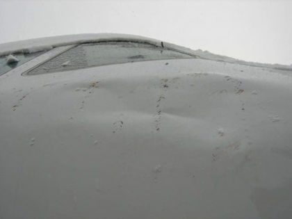 Photo 8 — Right hand side fuselage damage.