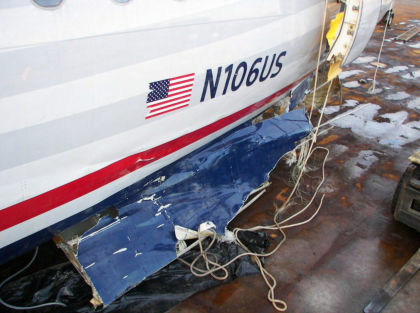 Photo 9 — Left hand side aft lower fuselage damage.