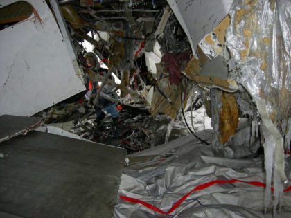 Photo 13 — Frame 57 looking aft at the tail cone damage.