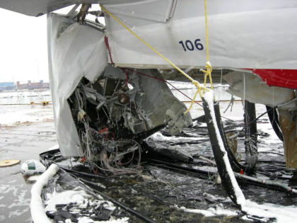 Photo 14 — Rear tail cone damage looking aft from frame 70.