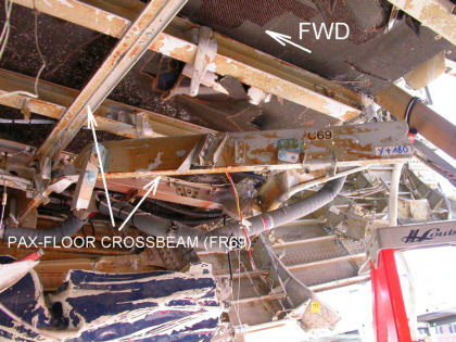 Photo 33 — Typical passenger crossbeam damage (crossbeam 69).