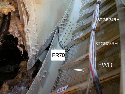 Photo 35 — Aft Pressure Bulkhead Damage.