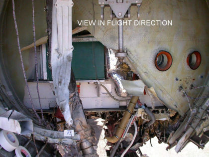 Photo 39 — Aft Pressure Bulkhead. Note the edge of the primary fracture is bent aft