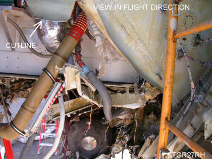Photo 41 — Aft Pressure Bulkhead. Note the edge of the primary fracture is bent aft