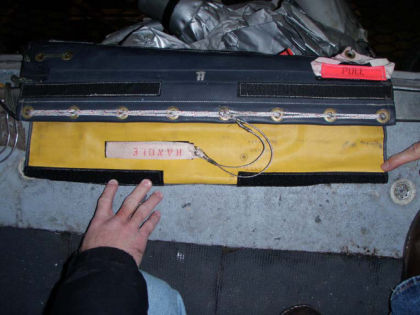 5. View of the intact 1R evacuation slide release handle and lacing.