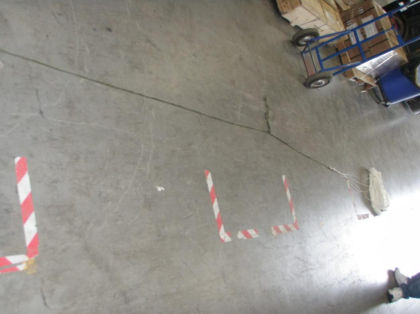 5. Photograph of the sea anchor and sea anchor line stretched out on the shop floor. Note: The yellow arrow points to the knot in the sea anchor line.