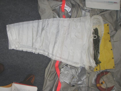 10. View of the unpacked 2L slide/raft sea anchor. Note: The sea anchor was found stowed in accordance with OEM vendor packing requirements.