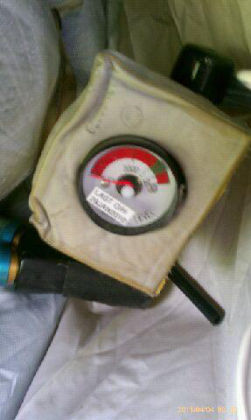 7. View of the 1R evacuation slide/raft inflation bottle pressure gauge. (Photograph provided by UAL.)