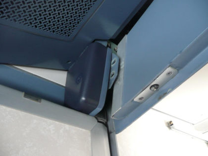 11. View looking at the upper cockpit door hinge from the inside cockpit. The door standoff bracket was found separated from the bulkhead.