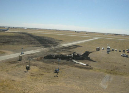 Photo 1 – Wreckage viewed from the airplane’s left side, viewer is looking east. (NTSB Photo)