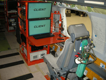 Photograph 2: Flight test engineer workstation with portable oxygen bottle and quick-don mask