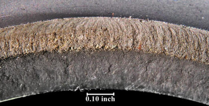 Figure 3. Images of the fracture surface of the mating half after cleaning. An origin can been seen on the OD at the root of a thread in the top of the images. (3 of 4)