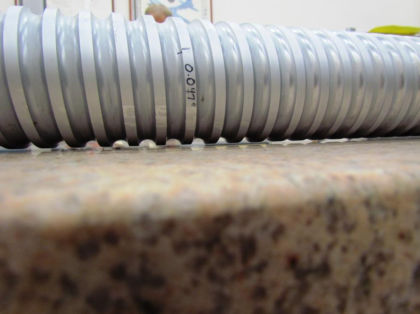 Figure 4. The ballscrew was laid on a precision table and 0.0455 inch of plastic deformation was measured with feeler gages. (2 of 3)