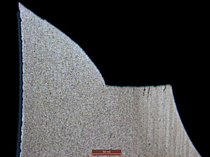 Figure 7. Micrograph of a cross section of the screw near the fracture, showing a microstructure typical of alloy steel. (2 of 3)