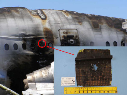 Photo 18. Snozzle penetration hole aft of door 2R.