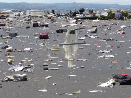 Photo 24. Debris on runway 28L.