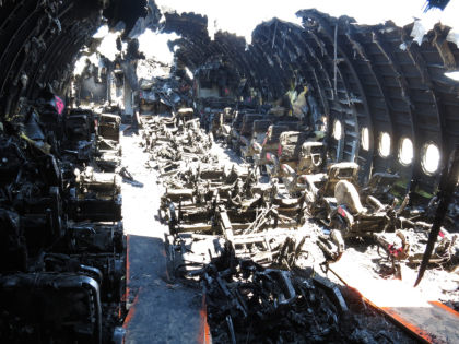 Photo 86. Forward-facing view of B-zone from left aisle near row 28 after debris removal.