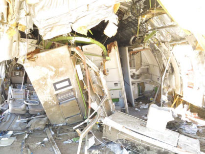 Photo 104. Forward-facing view of the aft of the airplane with debris removed.