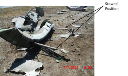 Photo 5- Left Engine Thrust Reverser Wreckage, Stowed Position — page 7 of 20