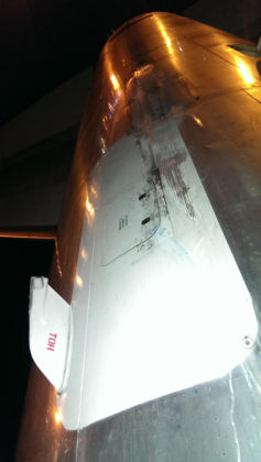 Photos - On-scene photos of lower fuselage skin and aft pressure bulkhead damage — page 2 of 14