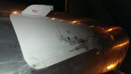 Photos - On-scene photos of lower fuselage skin and aft pressure bulkhead damage — page 3 of 14