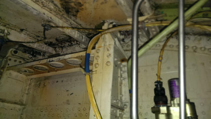 Photos - On-scene photos of lower fuselage skin and aft pressure bulkhead damage — page 8 of 14