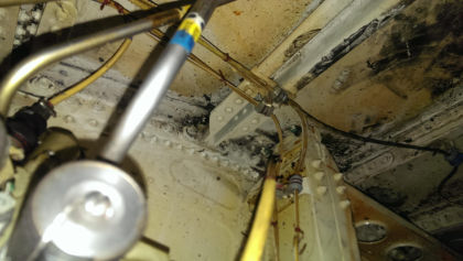 Photos - On-scene photos of lower fuselage skin and aft pressure bulkhead damage — page 9 of 14