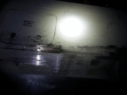 Photos - On-scene photos of lower fuselage skin and aft pressure bulkhead damage — page 12 of 14