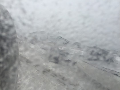 PHOTOGRAPH 3 - Photograph looking out of left side window at the left wing inside a