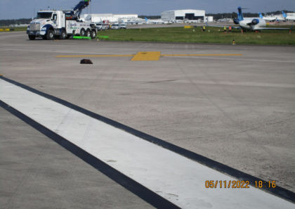 Photograph 2 – View of Runway Marks at Runway Edge (Courtesy FAA)