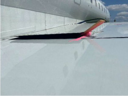 Photograph 4 – View of Damage to Flap Skin (Courtesy MHIRJ)