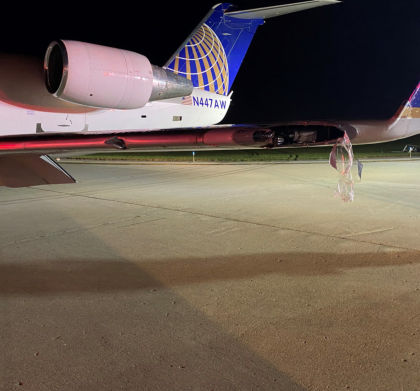 Photograph 5 – View of Minor Damage to Left Wing (Courtesy Air Wisconsin)